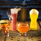 Left to right, the Outer Rim, Bespin Fizz, Yub Nub, and Fuzzy Tauntaun drinks from Oga’s Cantina.